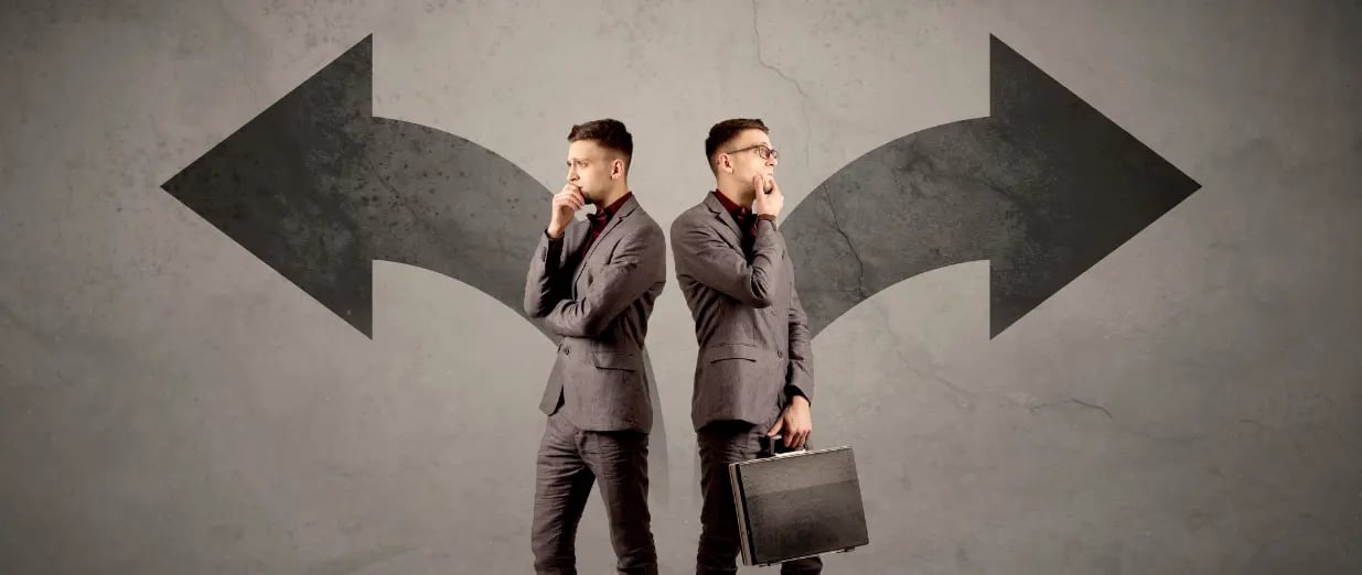 Two men standing back to back, thinking, with arrows pointing in opposite directions