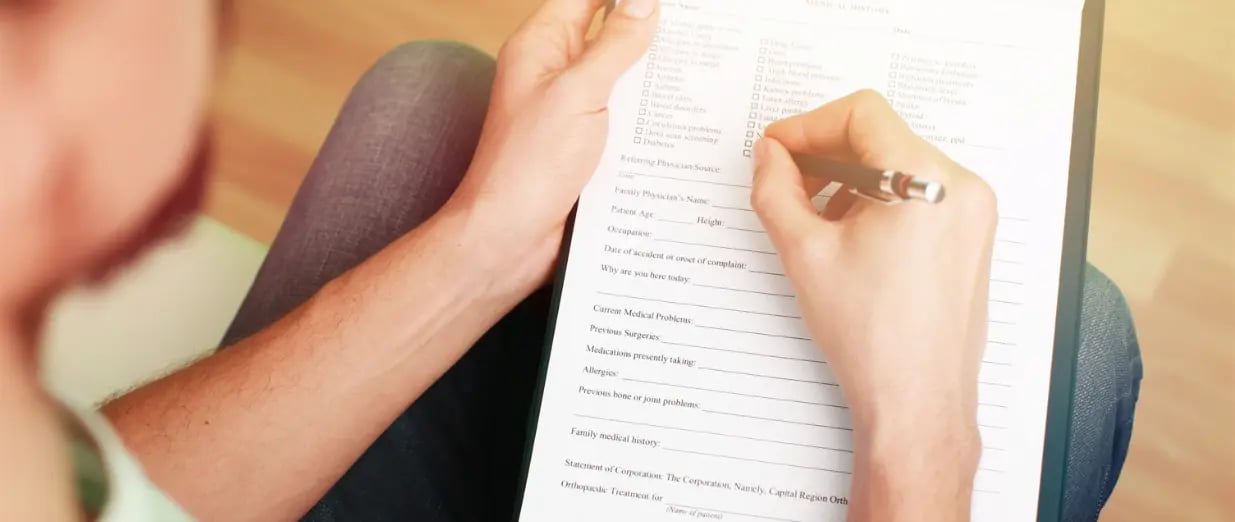 A man is filling out a questionnaire