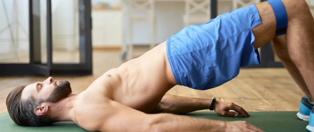A man performing pelvic floor exercises