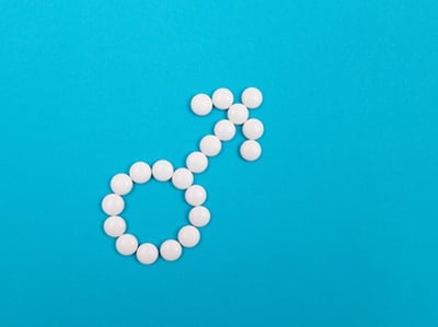 M&auml;nnliches Geschlechtssymbol aus wei&szlig;en Pillen